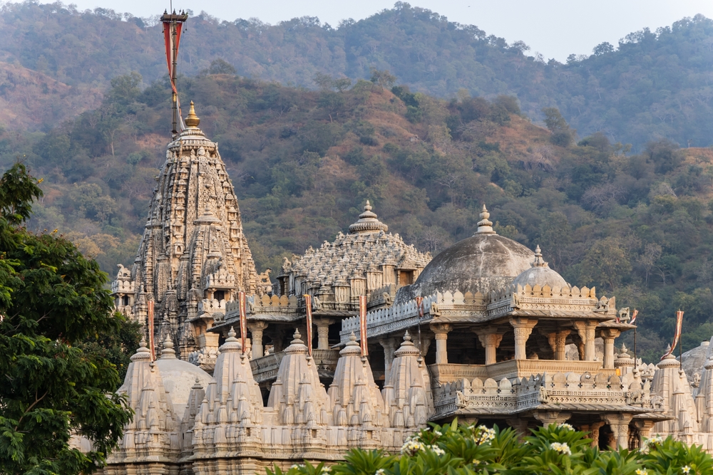 ancient unique temple architecture with bright blue sky at day from unique perspective image is taken at ranakpur jain temple rajasthan india.