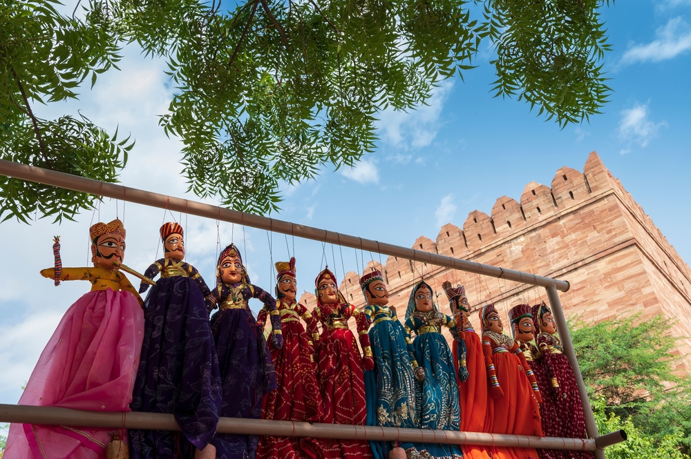 Traditional King and queen, called Raja Rani, handmade puppets or Katputli Sets are hanging for sale inside Meharangarh fort, Jodhpur,