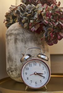 Alarm Clock and flower vase