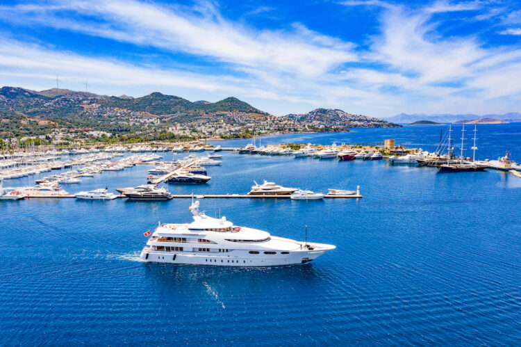 Aerial photo of luxury super yacht marina and sailing boats