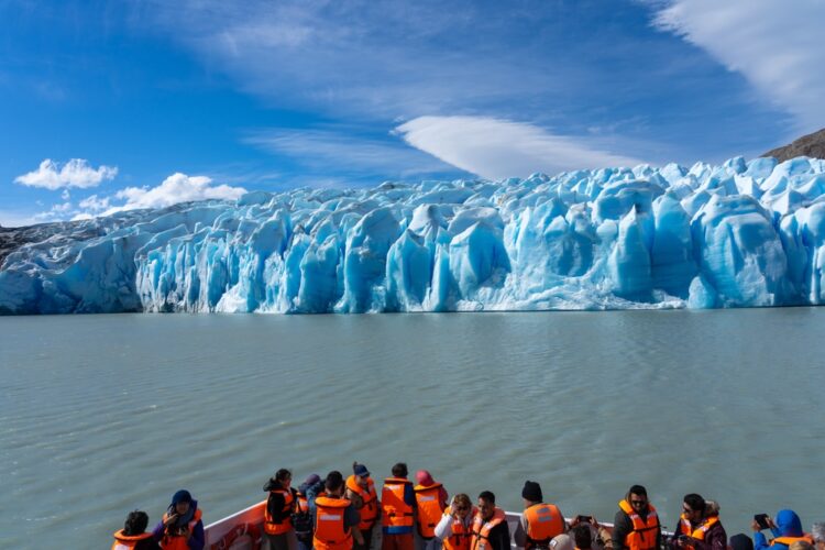 Puerto Natales, Chile - February 2, 2023: Tourists visiting Grey Glacier on the cruise in Torres del Paine National Park, Puerto Natales, Chile. Grey Glacier is glacier in Southern Patagonia ice field