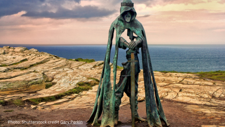 Tintagel, Cornwall, UK - The King Arthur statue Gallos by Rubin Eynon stands on a rocky headland on the Atlantic coast of Cornwall.