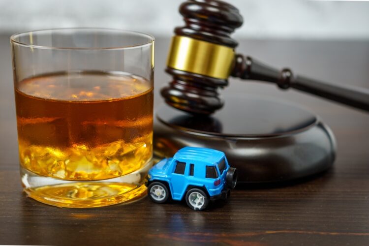 Graphic depicting the legal problems of traveling with a DUI. Judge's,Mace,On,A,Table