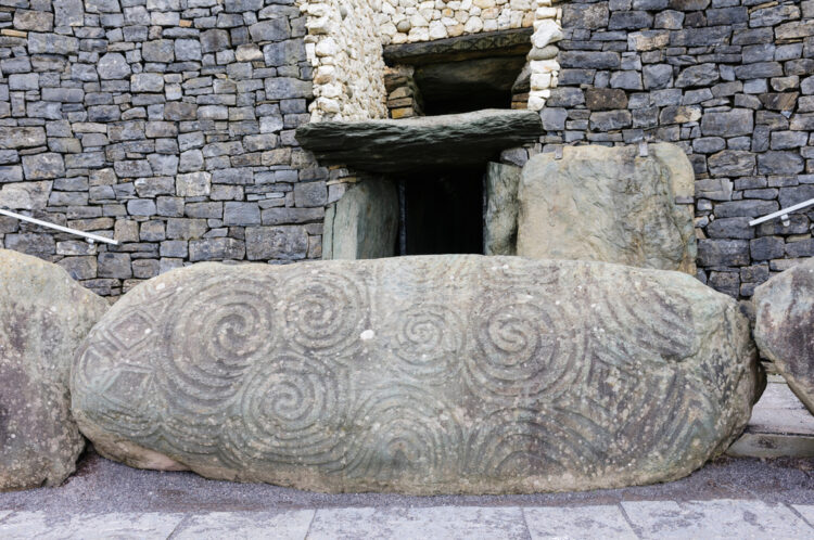 Spiral carvings on a kerb stone at the entrance to Newgrange