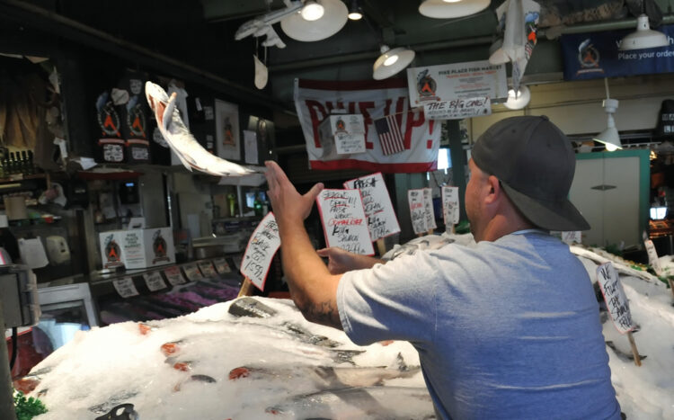 fish being tossed at Pikes Market in Seattle