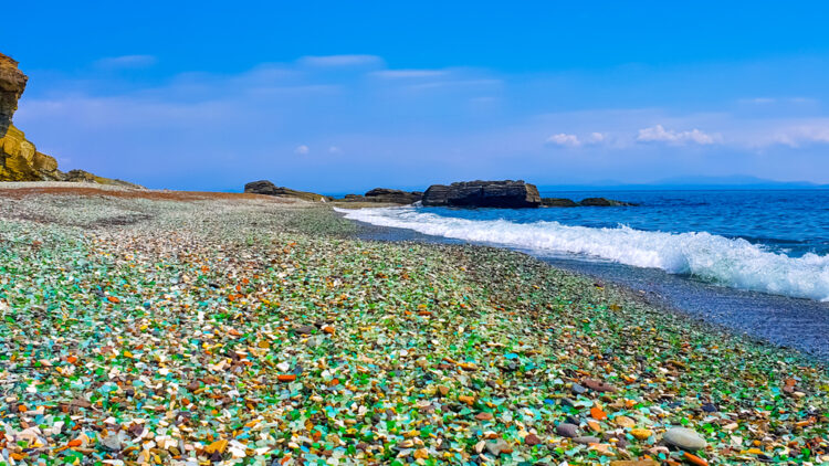 Colorful pieces of glass lying on the beach at Glass Beach, California