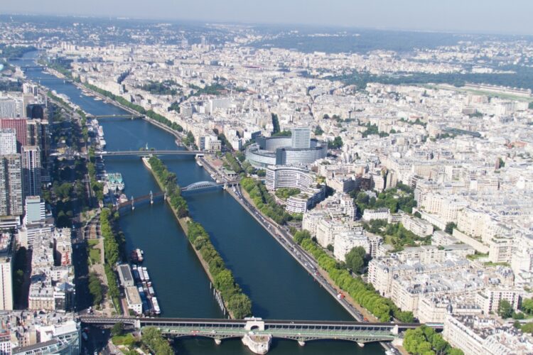 River Seine seen from above, clear and calm waters, bridges under a beautiful blue sky on a summer day in Paris.