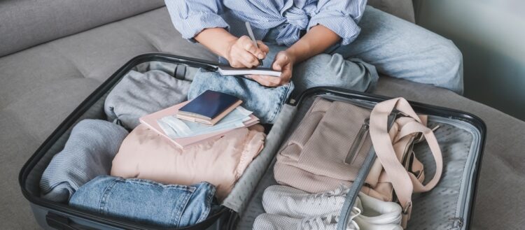 suitcase filled with clothing for travel