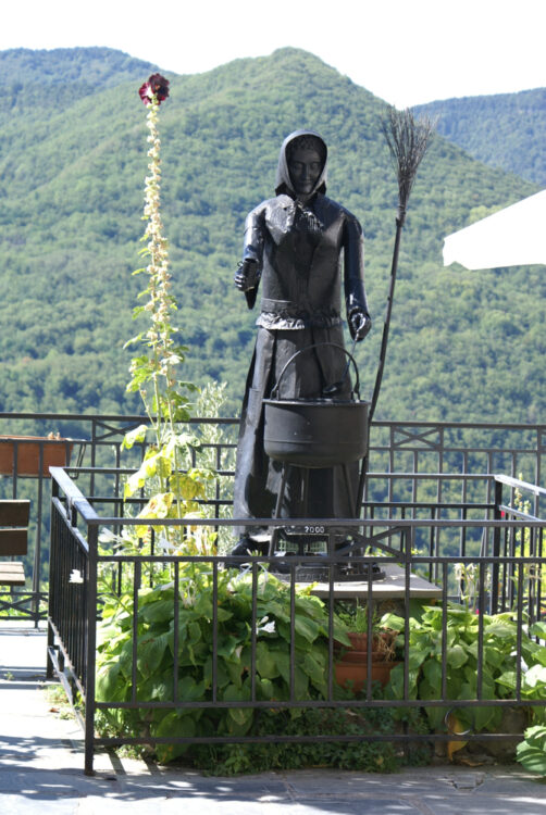 statue of a witch in the Ligurian Town of Witches