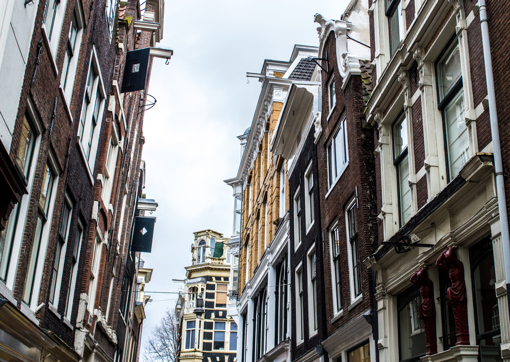 Amsterdam houses are leaning forward, they tilt to one side and some look like they might fall over