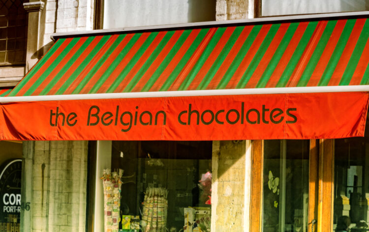 The Belgian Chocolates sign at sun shade of chocolate shop at downtown Brussels, Belgium.