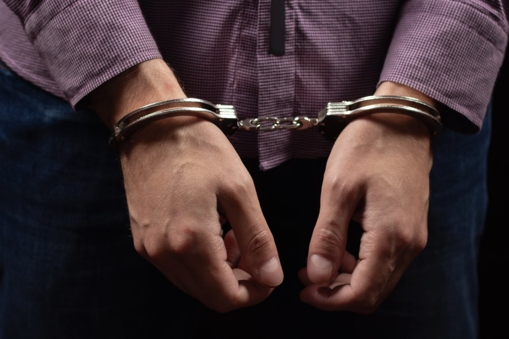Innocent Until Proven Otherwise: The laws you didn’t know you were breaking Handcuffs on a man