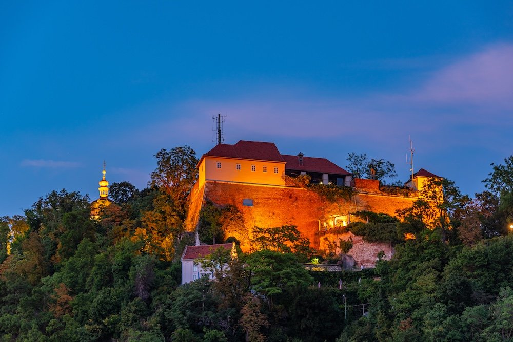 Night view of Schlossberg castle museum in Graz