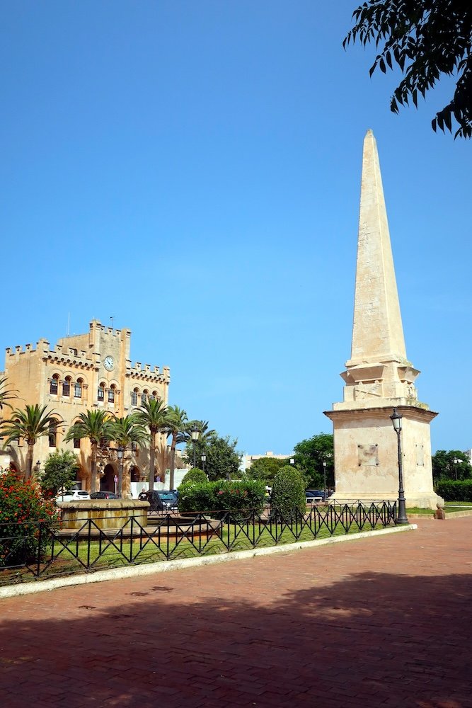 Obelisc placed in the center of Plaza del Borne and City Hall building