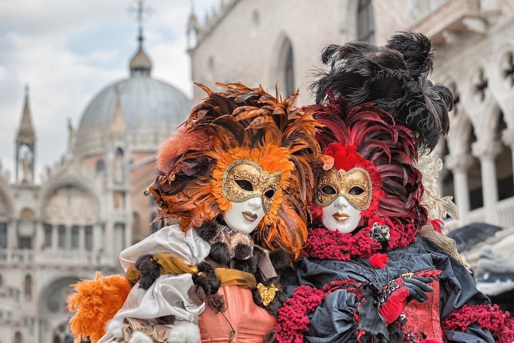 VENICE, ITALY - FEBRUARY 27, 2014: Unidentified person with Venetian Carnival mask in Venice, Italy on February 2014. In 2014 was the Venetian Carnival held between 15 February and 4 march